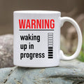 Warning: Waking Up In Progress — Funny Coffee Mug for Slow Mornings